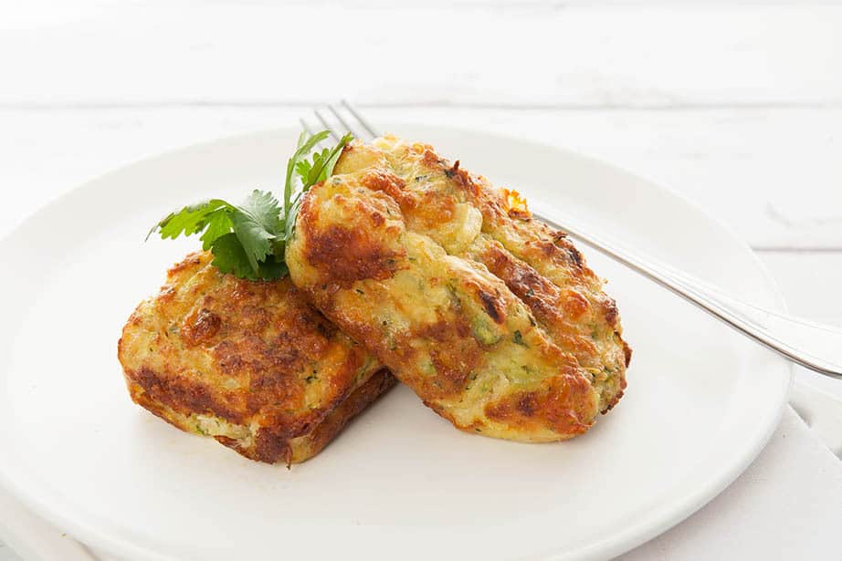 2 pieces of Zucchini slice on a white plate