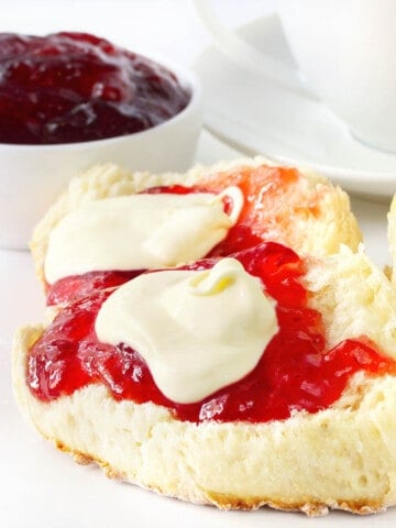 Scones with Jam and Cream on white background