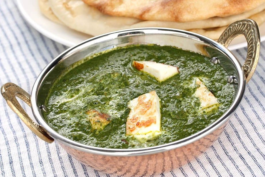 Palak Paneer recipe on a striped table cloth