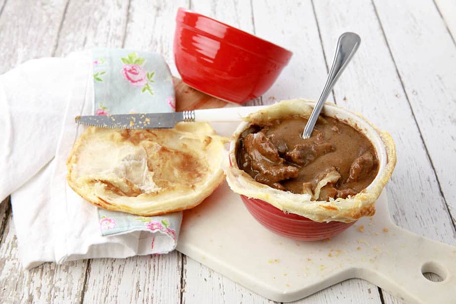 Guinness Pie with the pastry removed on a wood background