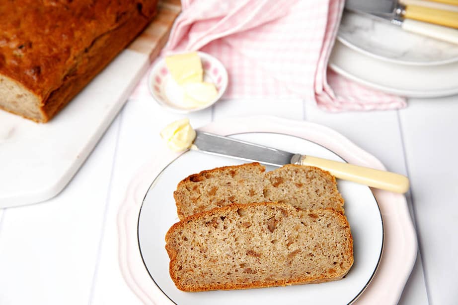 Healthy sugar free Banana Bread on a plate with butter