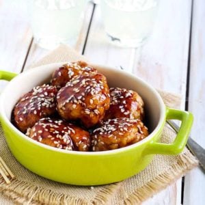 Chicken teriyaki meatballs in a green bowl