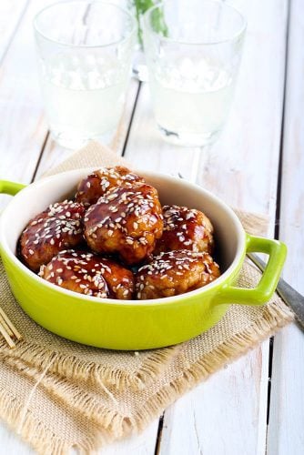 Chicken teriyaki meatballs in a green bowl