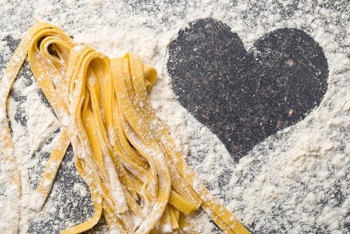 Square image of pasta on a black bench