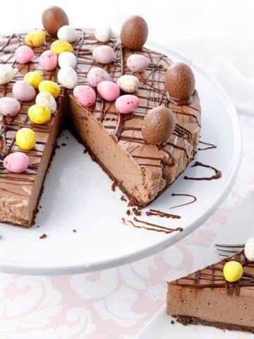 Thermomix chocolate cheesecake with a slice on a plate decorated in Easter Eggs