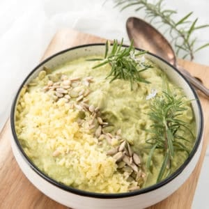 Square Image mashed cauliflower topped with herbs, nuts and cheese