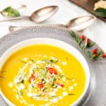 Overhead portrait image of Thai Pumpkin Soup in a white bowl