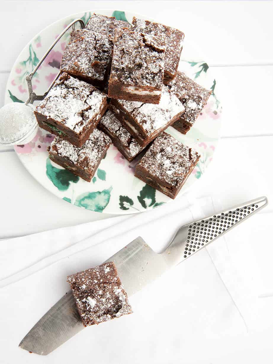 Peppermint crisp chocolate brownie on a floral plate with a white background