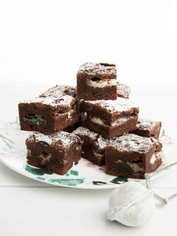 Peppermint chocolate brownie on a floral plate with white background