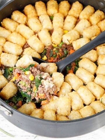 Thermomix Shepherds Pie with potato gems in a round backing dish