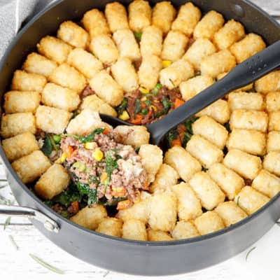 Thermomix Shepherds Pie with potato gems in a round backing dish