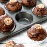 Close up double chocolate muffin on white wood background