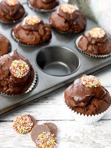 Close up double chocolate muffin on white wood background