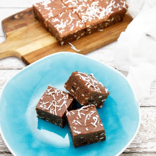 Thermomix chocolate weetbix slice on blue plate and white background