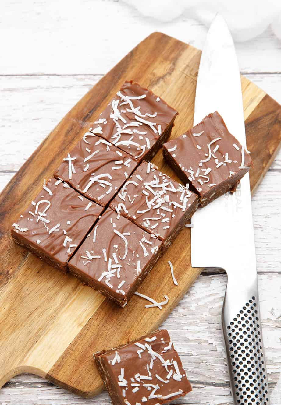 Chocolate weetbix slice on a wooden chopping board