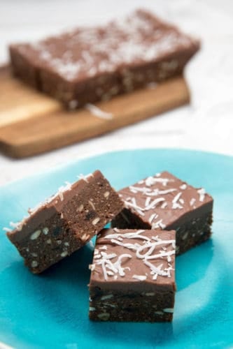 Close up Chocolate Weetbix slice on blue gloss plate