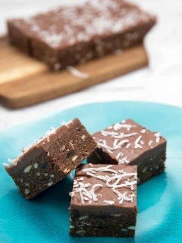 Close up Chocolate Weetbix slice on blue gloss plate