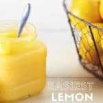 Lemon curd in a jar with a spoon in it