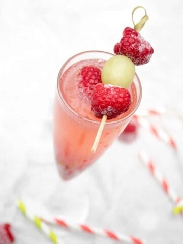 Close up Champagne cocktail raspberry Bellini