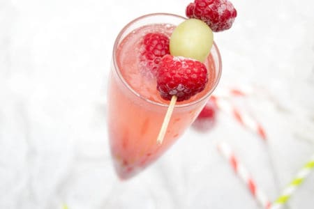 Close up Champagne cocktail raspberry Bellini