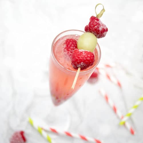 Close up Champagne cocktail raspberry Bellini