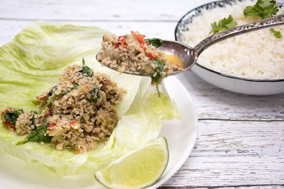 Pork Larb being spooned into lettuce cups