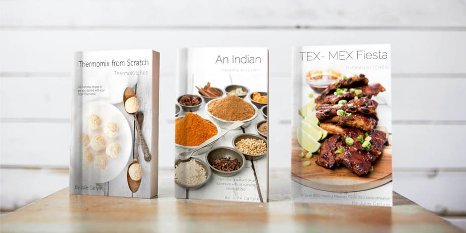 Image of 3 ThermoKitchen cookbooks on a desk