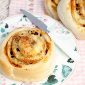 Cheesymite scrolls on plate with more in the background