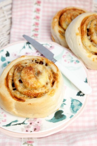 Cheesymite scrolls on plate with more in the background