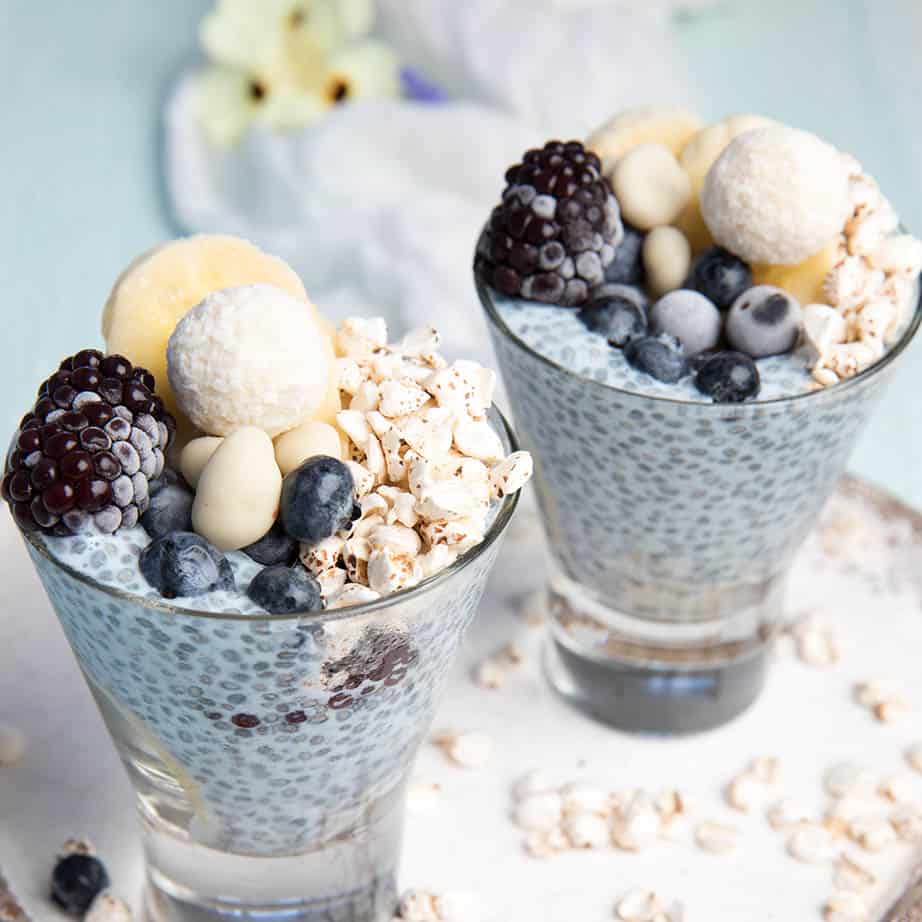 Square crop of mermaid chia pudding with fruit in a galss