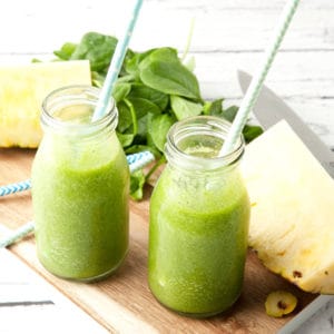 Image of tropical green smoothie and ingredients