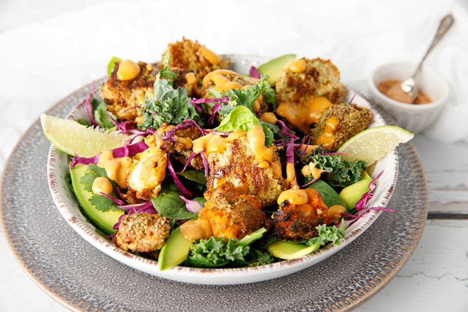 Keto Popcorn Chicken Salad in a bowl on white background