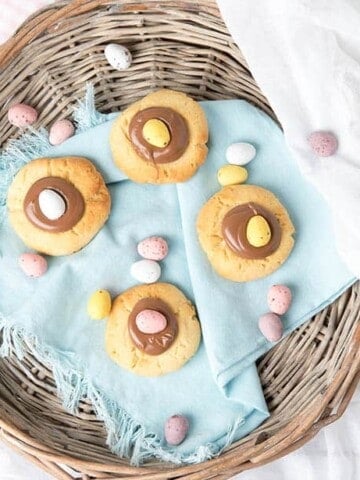 Overhead shot of Easter Cookies in a basket with a blue napkin