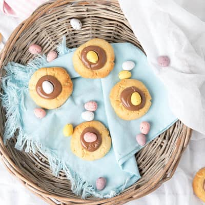 Overhead shot of Easter Cookies in a basket with a blue napkin