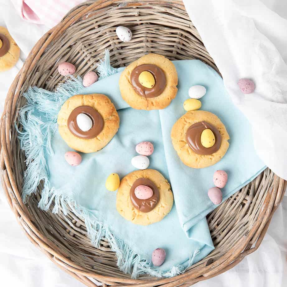 Square overhead image of Easter Thumbprint Cookies with chocolate