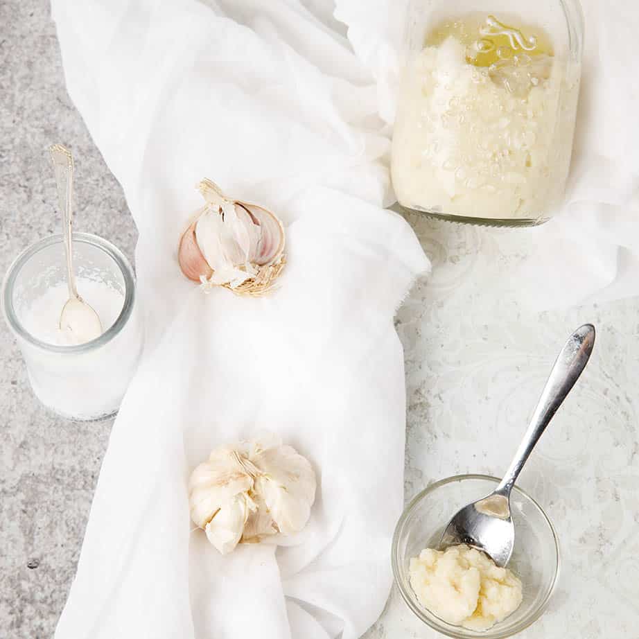 Square crop of garlic paste and whole ingredients