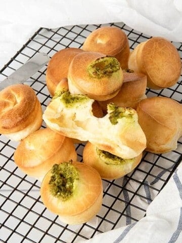 Overhead shot of Brazilian Cheese puffs on a cooling tray.