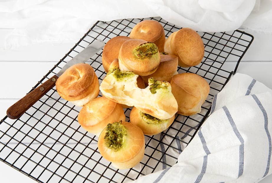 Overhead shot of Brazilian Cheese puffs on a cooling tray.