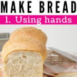 Loaf of bread labelled for pinterest as being made by hand with hands