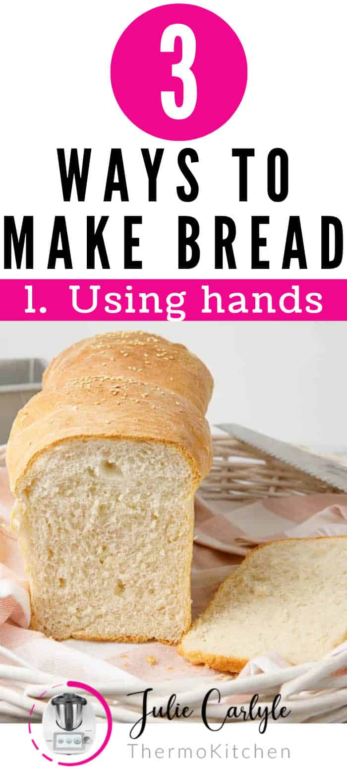 Loaf of bread labelled for pinterest as being made by hand with hands