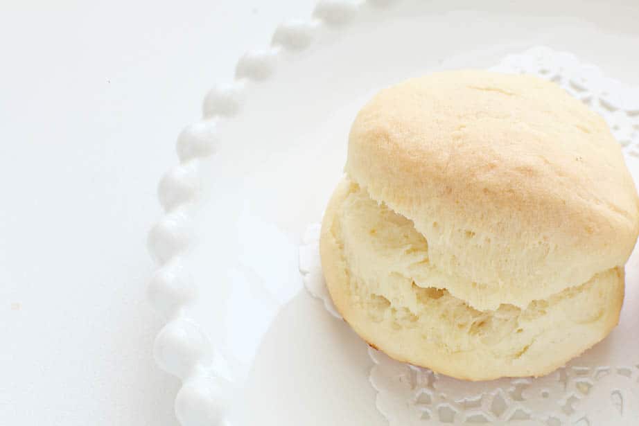 Fluffy scones on white crockery and white background