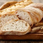 Various different styles of sourdough workshop breads on a chopping board