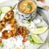 Overhead image of Malaysian Chicken Skewers on rice