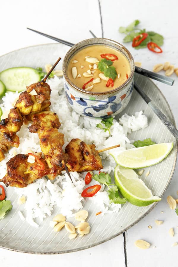 Overhead image of Malaysian Chicken Skewers on rice