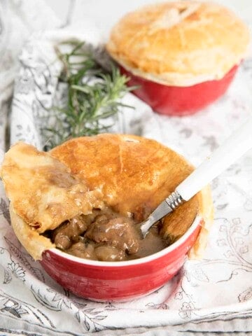 Two Peppercorn pot pies one with the pastry removed