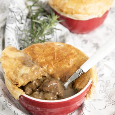 Two Peppercorn pot pies one with the pastry removed