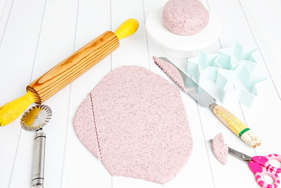 White table with Thermomix playdough and cookie cutters and rolling pin