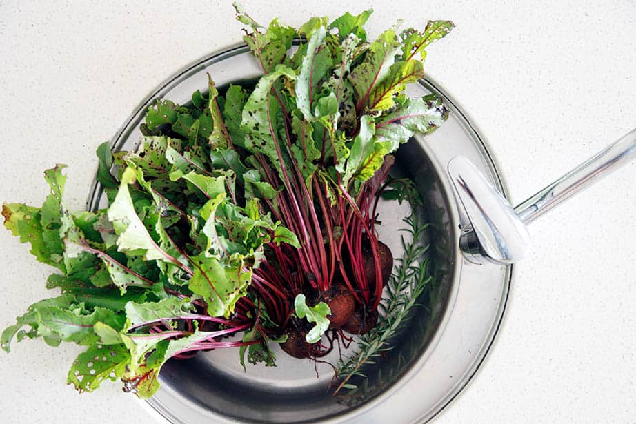 Freshly picked beetroot in the kitchen sink