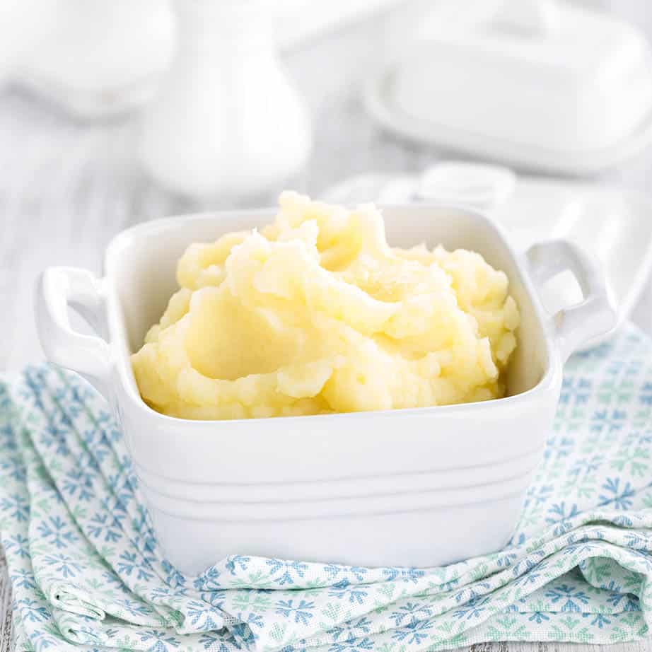 square pic Thermomix mashed potato in a white bowl, white background