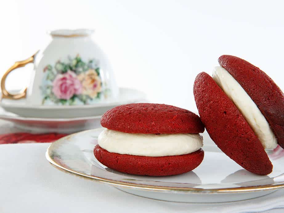 Landscape close up of red velvet whoopie pies on white background